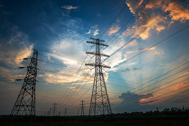the pylon Electricity Pylon power line transmission tower at sunset power line stock pictures, royalty-free photos & images