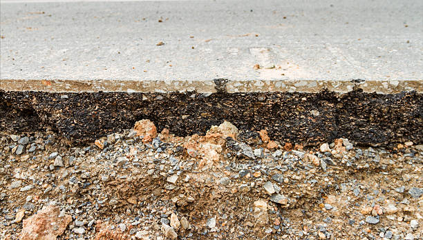 istock Damaged asphalt on the road.. 492070404