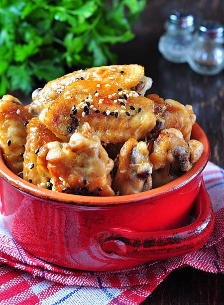 istock baked chicken wings in soy sauce with sesame seeds 492070596