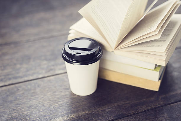 istock Cup of coffee and books on the floor 492072290