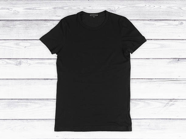 istock Black blank T-shirt on a white wooden background 492072762