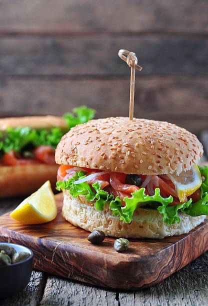 istock burger with pickled salmon, lettuce, white onion and capers 492075852