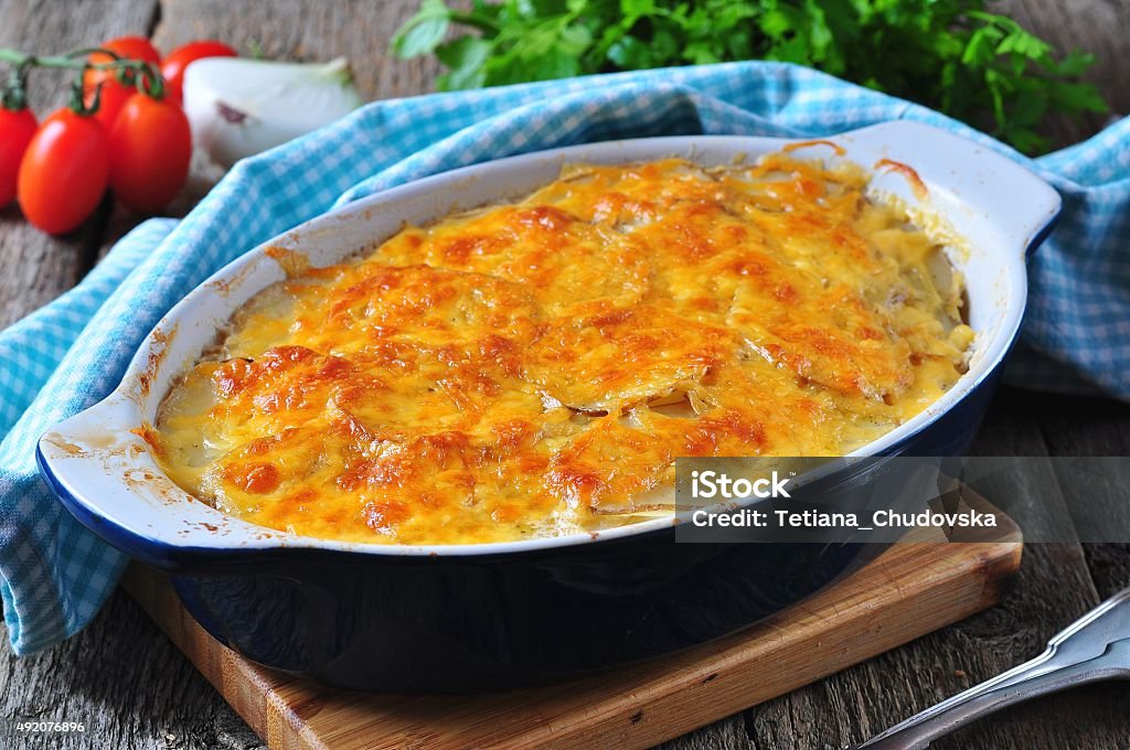 potato casserole with chicken, onions and cheese Baked Potato Stock Photo
