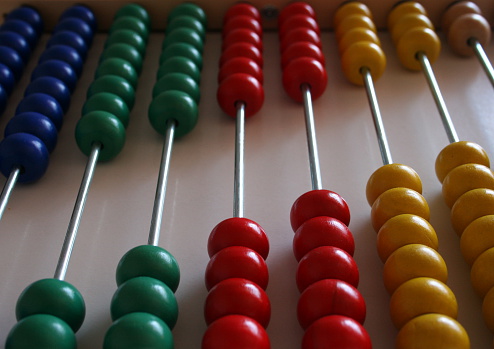 Colorful beads of abacus stacked diagonally 