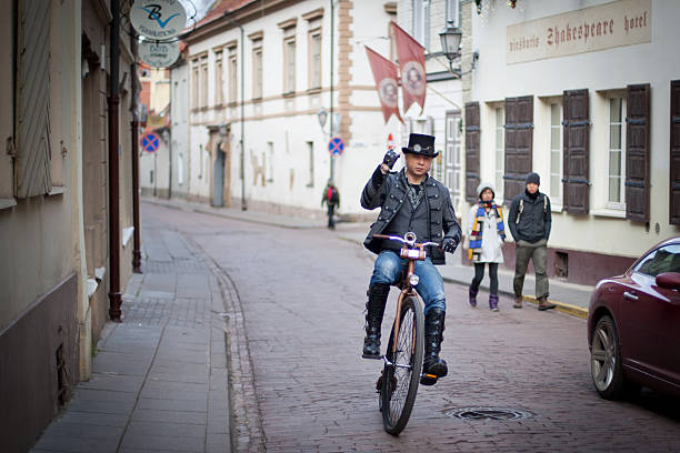 Vilnius, Lithuania, 29 December - 2013. Funny bycyclist on a street of Vilnius