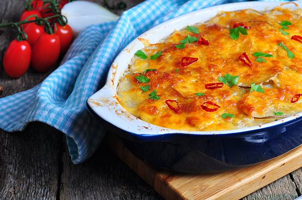 potato casserole with chicken, onions and cheese