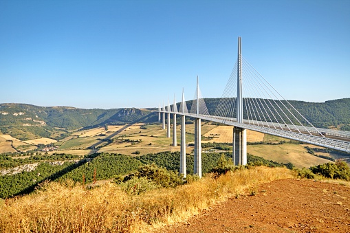 Millau, France - July 10, 2015: bridge at Millau, Millau Viaduct designed by the French structural engineer Michel Virlogeux and British architect Norman Foster, it is the tallest bridge in the world . 