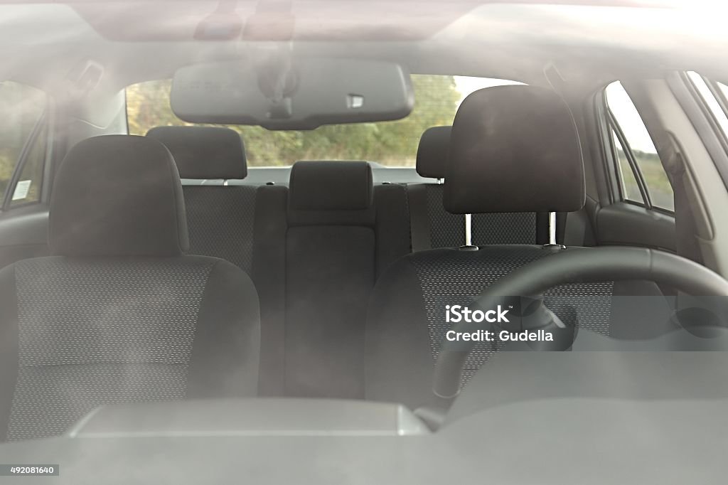 Car Interior Car interior behind flaring reflections of the windscreen Front View Stock Photo