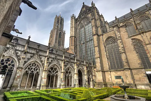 The cloister garden and the tower of the Dom Cathedral of Utrecht, Holland