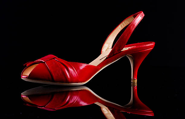 istock Female shoe on a glossy black background 492092878