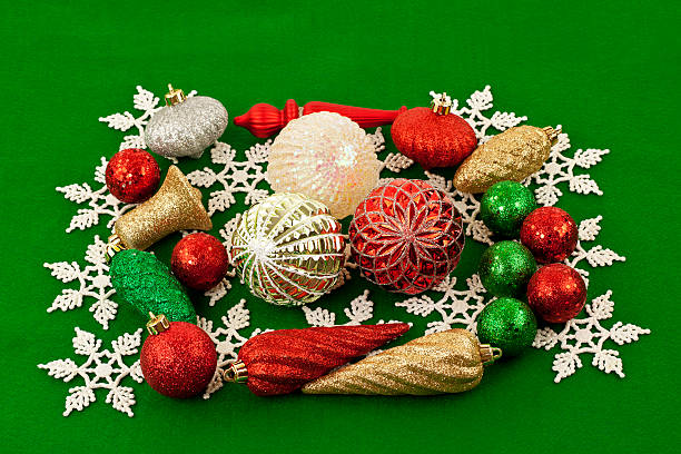 istock Christmas Ornaments on a Green Background 492093074