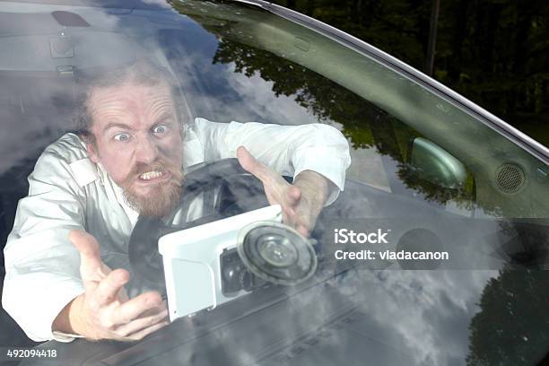 Driver Furious On Gps Navigation A Wrong Way Stock Photo - Download Image Now - Global Positioning System, Anger, Displeased