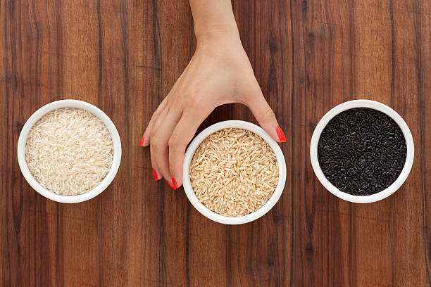 предлагая rices - brown rice basmati rice rice cereal стоковые фото и изображения