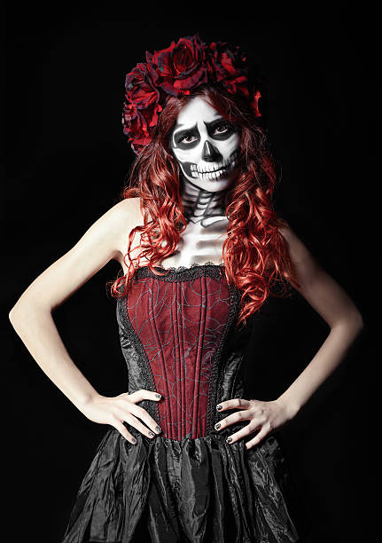 istock Sad young woman with calavera makeup (sugar skull) 492096296