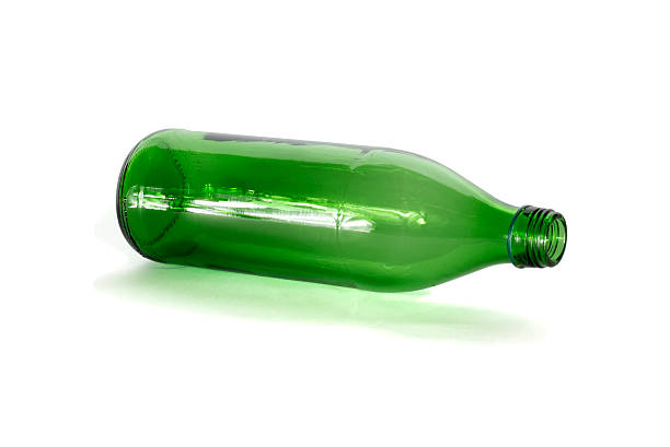 Empty bottle An empty green bottle on white background. returnable stock pictures, royalty-free photos & images