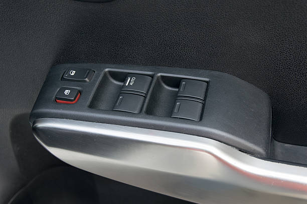 istock car interior details of door handle with windows controls 492098154