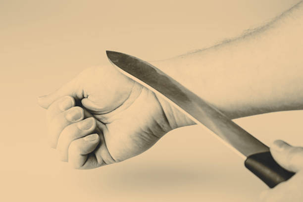 istock Close up of a suicidal man hand isolated 492099430
