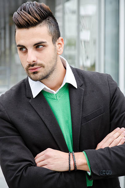 istock businessman standing arms crossed 492100580