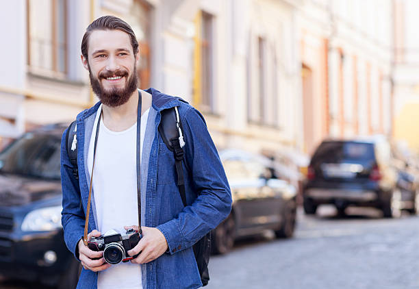 istock Cheerful bearded tourist is making his journey 492101332