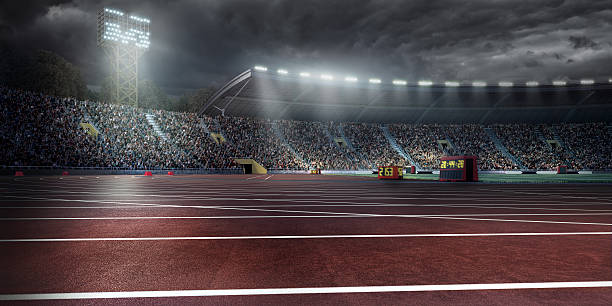 . stadium with running tracks On the foreground you can see professional running tracks of a sport championship stadium at the evening. A long-range shot of a running tracks, floodlights and seating.  In the background are diffuse out-of-focus stadium seats with full bleachers. The whole image is made in 3D. image created 21st century blue architecture wide angle lens stock pictures, royalty-free photos & images