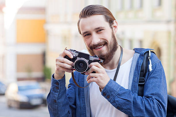 istock Attractive young man is traveling and making photos 492101702