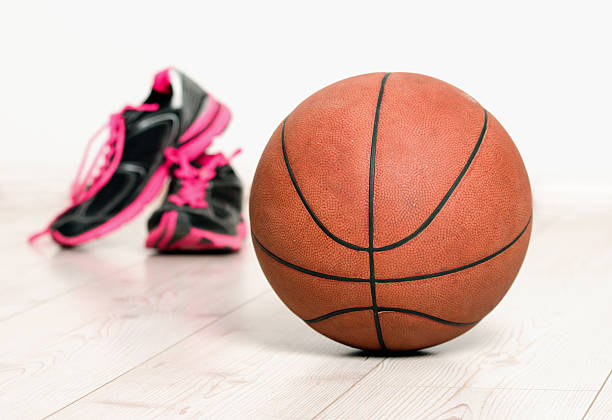 istock Ball and sneakers for basket 492103216