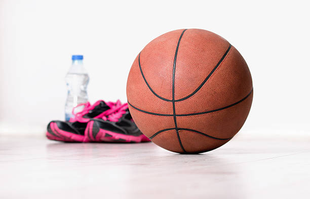 istock Ball and sneakers for basket 492103344