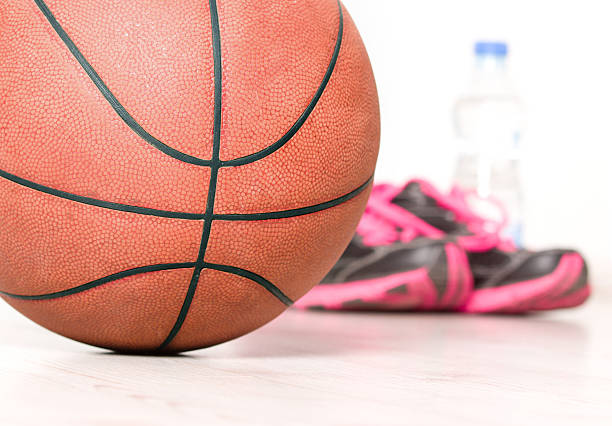 istock Ball and sneakers for basket 492103826