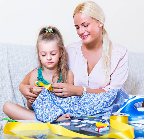 istock Mom and child with sew 492106502