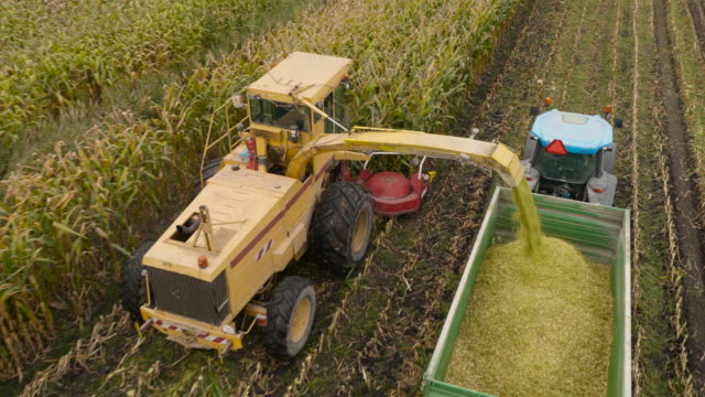 4K Aerial: Top Passing Corn machines
