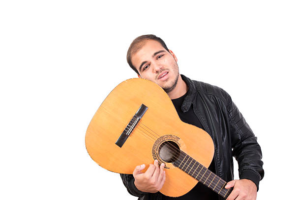 istock Young Man With an Old Acoustic Guitar 492118850