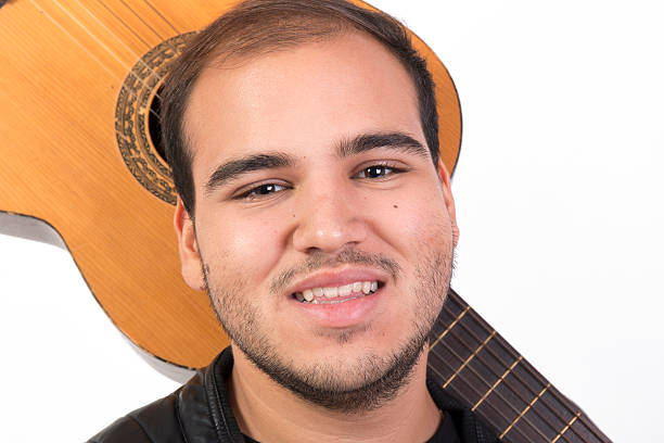 Young Man With an Old Acoustic Guitar
