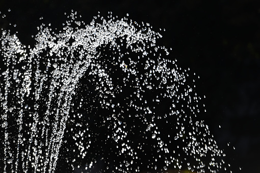Fountain water in the night - close-up