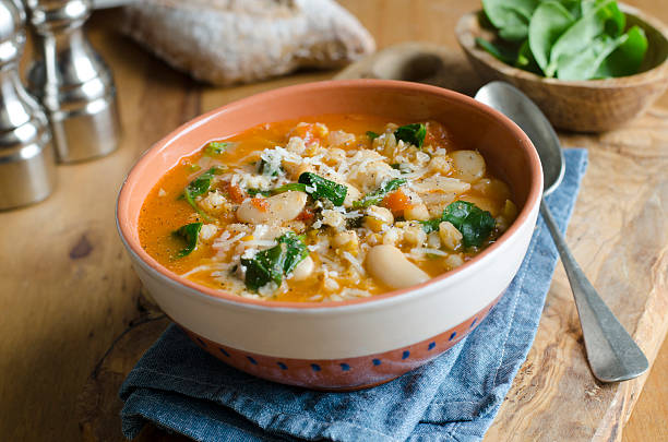 Butter bean and barley soup Pearl barley, butter bean and chickpea soup topped with grated Parmesan vegetable soup stock pictures, royalty-free photos & images