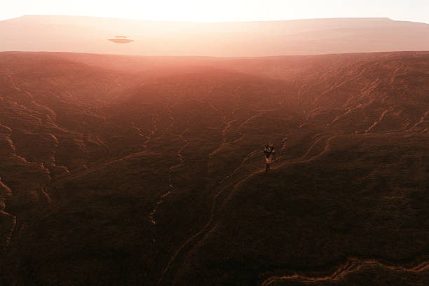 istock UFO flying over Martian landscape, astronaut 492124042