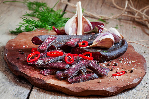 istock Sliced smoked sausage with garlic and pepper 492124114