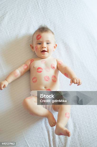 Baby Covered With Red Kisses Stock Photo - Download Image Now - 2015, Affectionate, Baby - Human Age