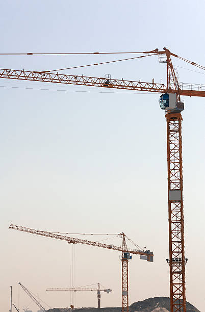 istock Dubai skyscrapers, crane working in construction site, building and carrying 492128012