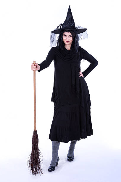 istock Witch Holding Pumpkin - Heloween Costume posing 492129824