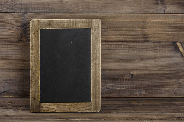 istock Antique chalkboard on wooden texture. Rustic background 492129892