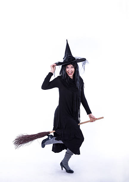 istock Pretty Smiling Witch Reday to Fly on Broom 492129980