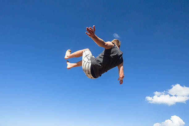 istock Teen Boy Jumping Summersault 492145589