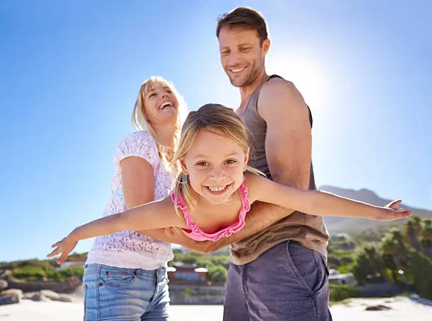 Shot of a happy young family being playful at the beachhttp://195.154.178.81/DATA/shoots/ic_783368.jpg