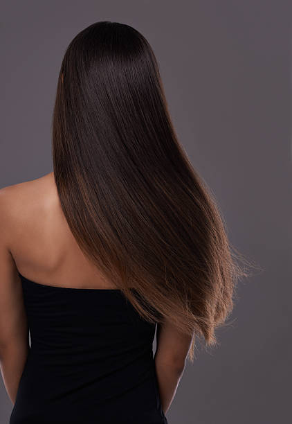 gesundes haar in bestform! - women long hair rear view beauty stock-fotos und bilder