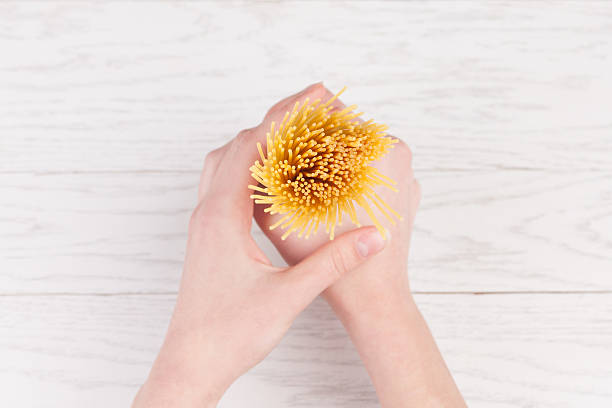 istock Italian spaghetti in female hands 492147185