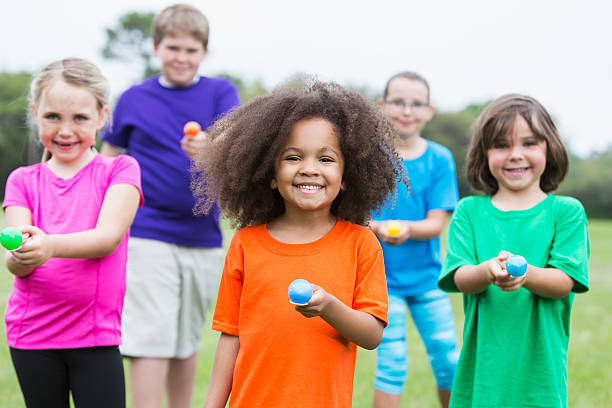 istock Multiracial group of children in an egg spoon race 492147314