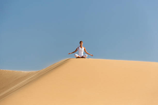 istock Yoga meditation on the beach 492147463