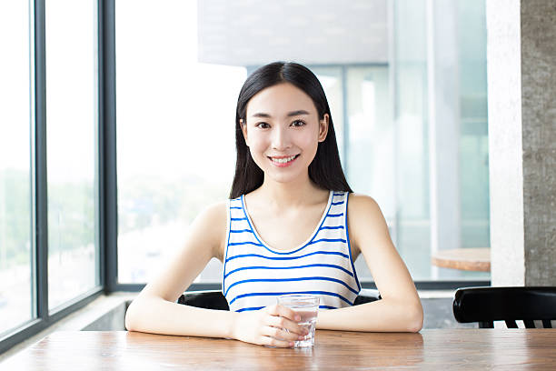istock smiling woman with and coffee 492148330