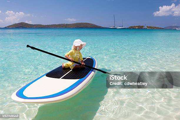 Toddler Learning How To Paddle On Paddleboard In The Caribbean Stock Photo - Download Image Now