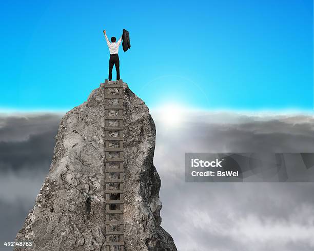 Cheering On Top Of Rock Mountain With Sunrise Stock Photo - Download Image Now - Businessman, Mountain Peak, Standing